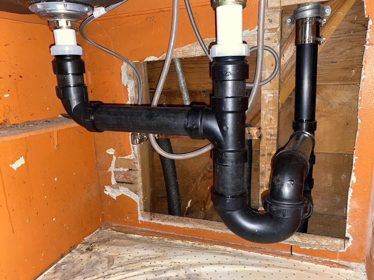 Professional Garbage Disposal Repair equipment and tools on the job in Essex